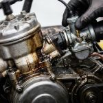 Mechanic inspecting a race kart engine before competition